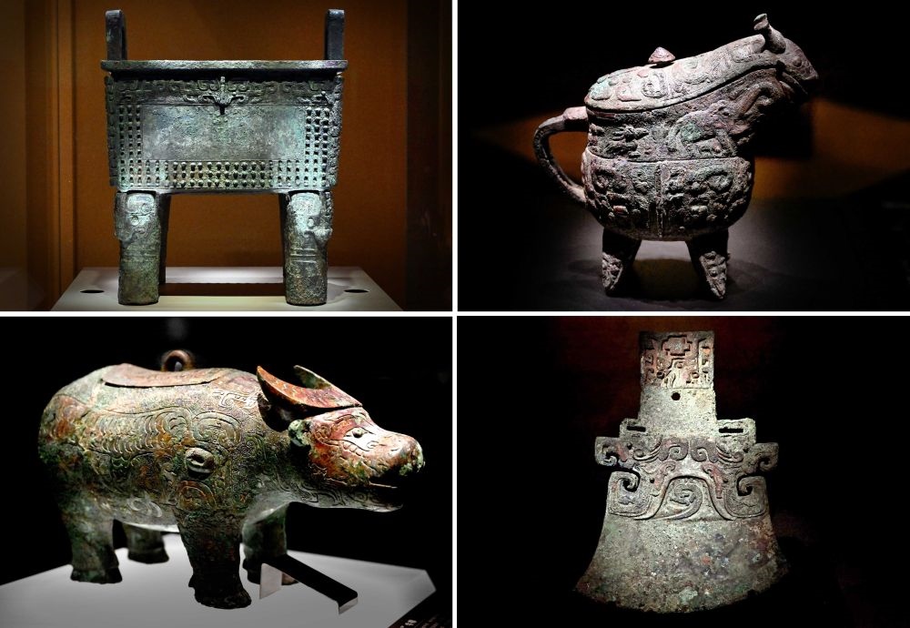 這是殷墟博物館新館內(nèi)展出的“司母辛”銅鼎（左上）、“亞長”銅?。ㄓ疑希ⅰ皝嗛L”牛尊（左下）、“亞長”銅鉞（拼版照片，2月23日攝）。